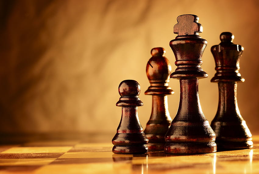Wooden chess pieces on a chessboard and HD wallpaper