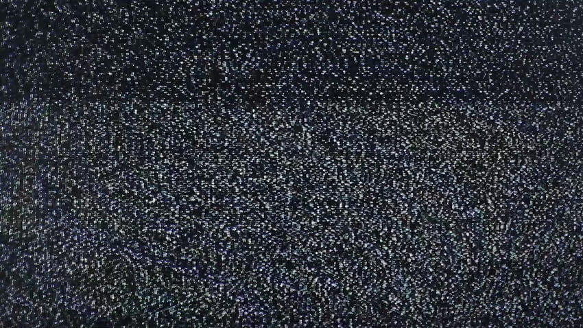 Tv noise pollution grains. Static grainy noise from an old analog tv screen. Bad signal, weak reception, digital pollution. Real footage. HD wallpaper