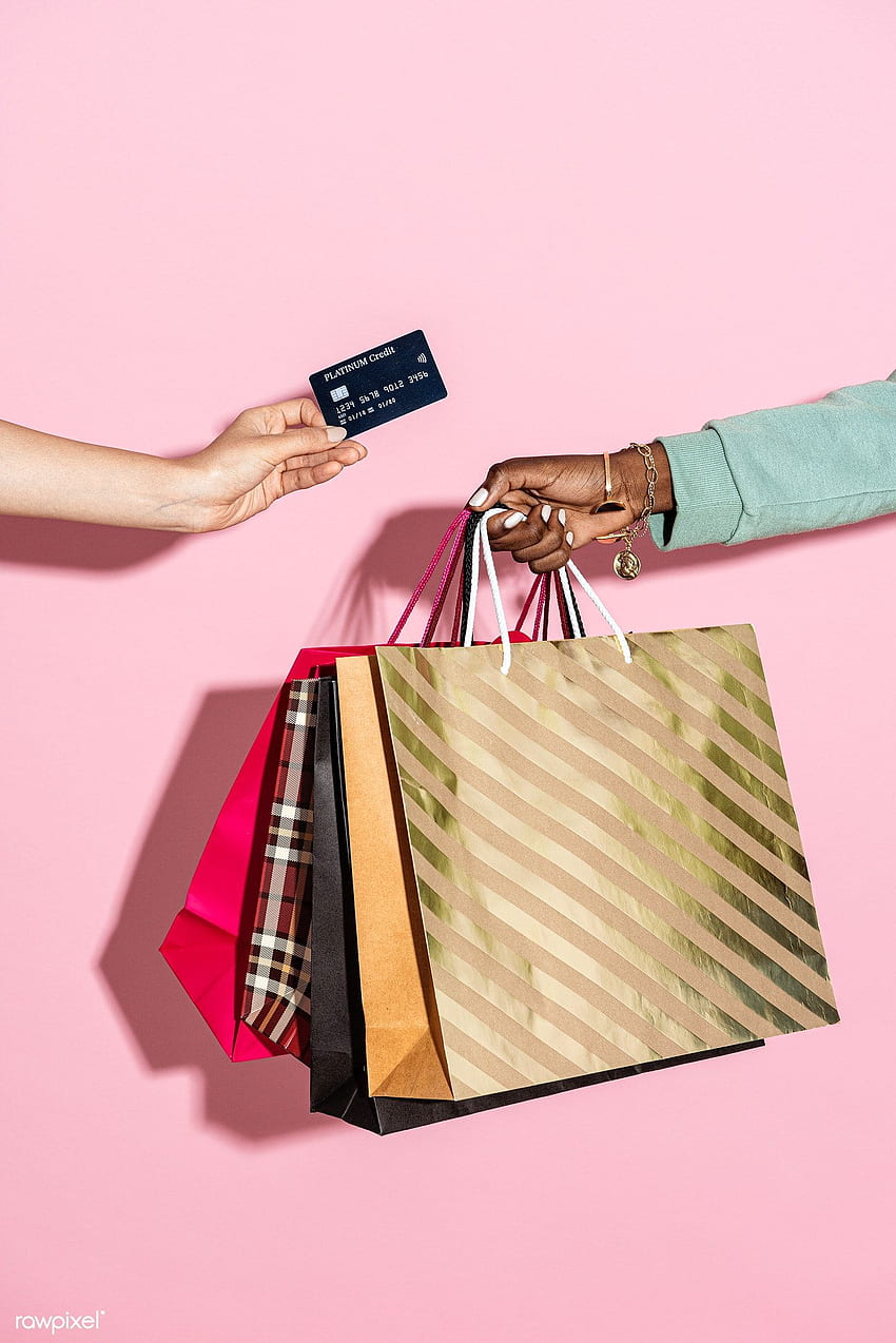 premium of Woman with shopping bags and a credit card against a pink background by Teddy about shopping, shopping bag, credit card, money, and ho. Pink background, Credit card HD phone wallpaper