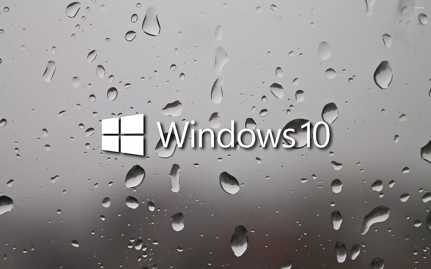 濡れた窓に Windows 10 の白いテキスト ロゴ - コンピューター 高画質の壁紙