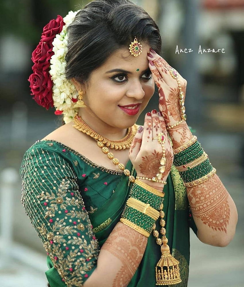 Kerala bride and groom Red and green comb  Kerala bride Bride Fashion