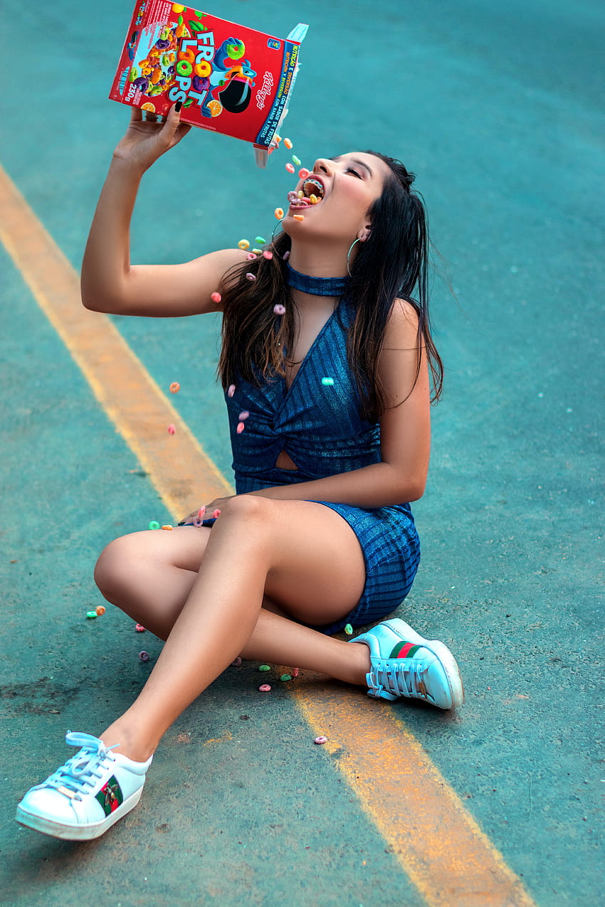 Woman Sitting on the Road Eating Froot Loops · Stock HD phone wallpaper