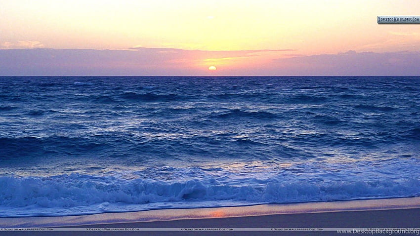 夕日と大西洋の波のあるビーチ 高画質の壁紙