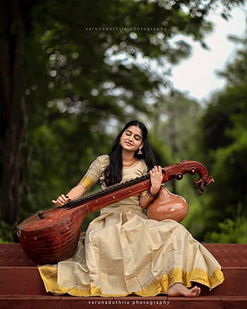 Playing veena hi-res stock photography and images - Alamy