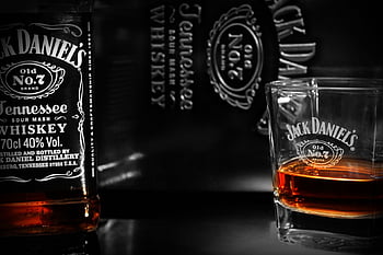 Jack Daniel’s SIngle Barrel bottle beside shot glass, jack daniels