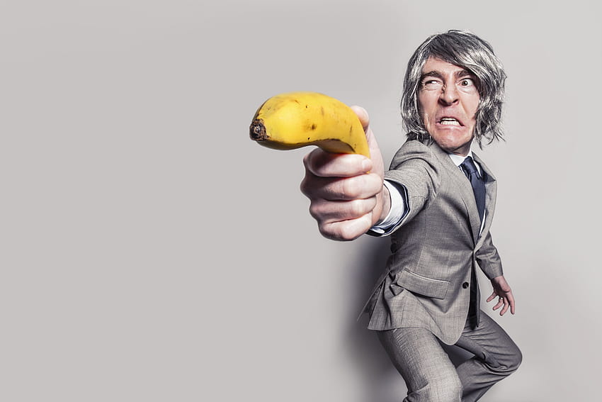 Man in Gray Suit Jacket Holding Yellow Banana Fruit While Making Face · Stock HD wallpaper