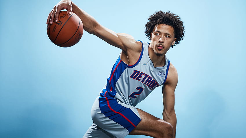 Cade Cunningham With Basketball In Blue Background Sports HD wallpaper