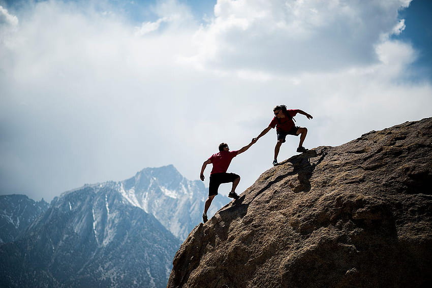 Teamwork couple climbing helping hand HD wallpaper
