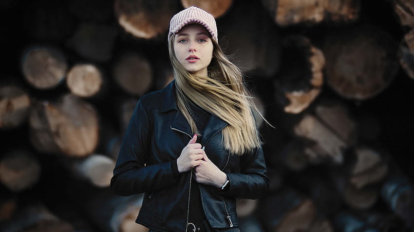 Beautiful Girl Model Is Standing In Blur Wood Logs Background Wearing Black Dress Jerkin And Light Pink Cap Girls HD wallpaper