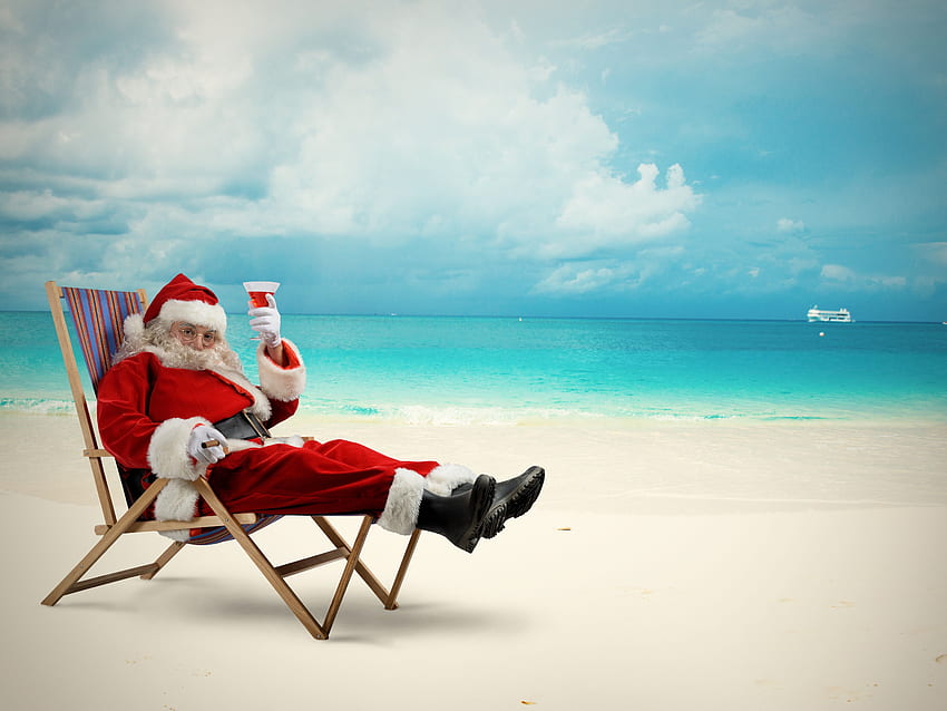 Happy Santa Claus drinking a cocktail on the beach. Christmas HD wallpaper