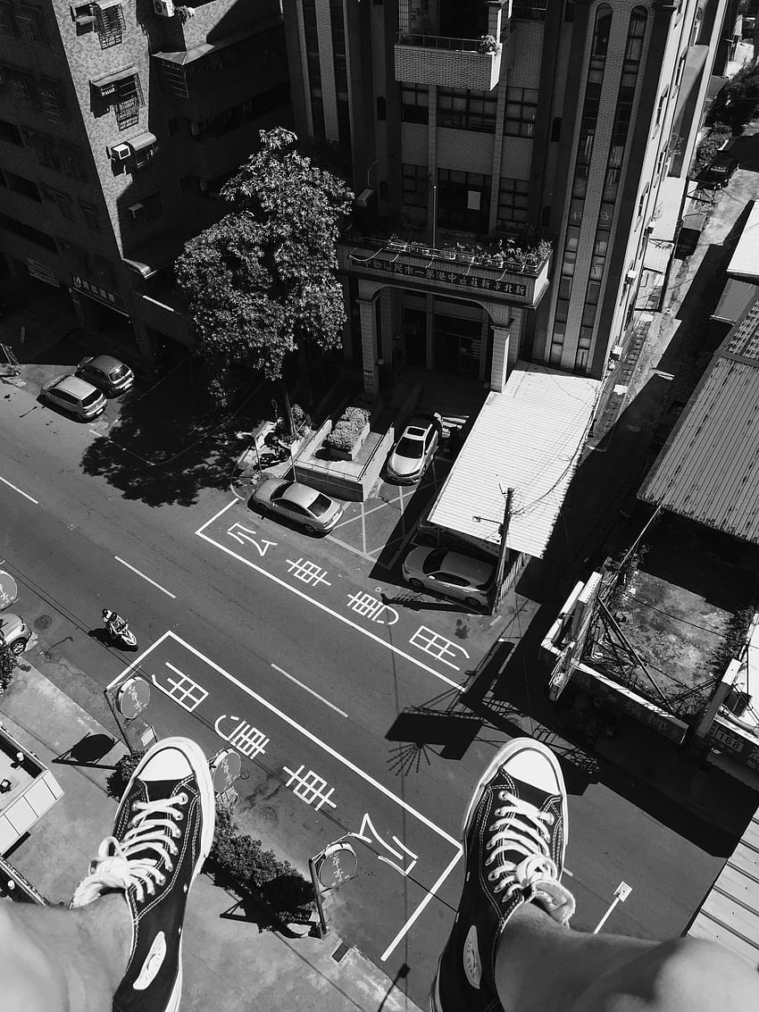 Grayscale graphy Man Wearing All Star Converse High Tops Below in Street and Building · Stock HD phone wallpaper