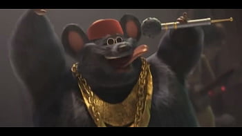 Biggie cheese singing live on a large stage