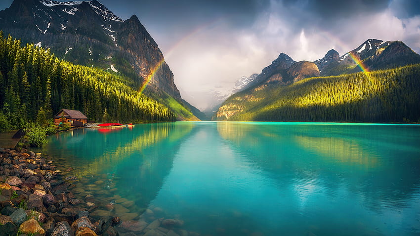 Rainbow over lake, lakeshore, beautiful, peaceful, rocks, cabin, mountain, lake, serenity, tranquil, rainbow, reflection, sky HD wallpaper