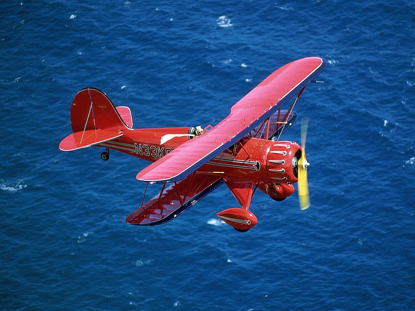 Red airplane flying above the blue sea. Planes ., Beautiful Planes HD wallpaper